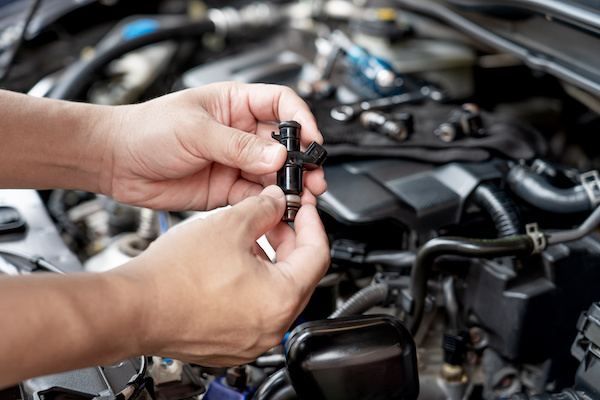 Car maintenance focusing on how to clean a car’s fuel injectors