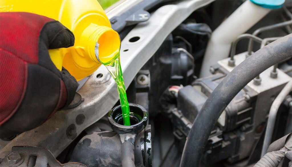 Can You Put Water in a Car Radiator - Pouring Coolant into Radiator